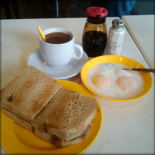 Kaya toast, half-boiled eggs, kopi C kosong.