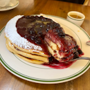 The signature Blueberry Pancakes with Warm Maple Butter ($21++).