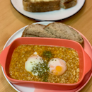 Baked Eggs in Crabmeat Laksa Sauce with Sourdough Bread | $14