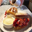 Strawberry waffle with LOTS of whipped cream.