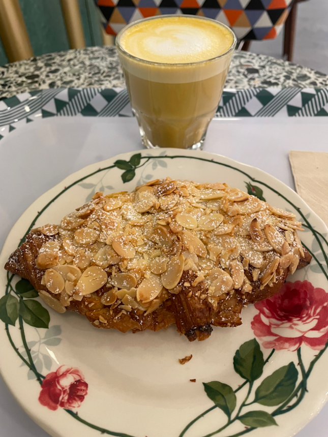 Almond croissant with turmeric oat latte
