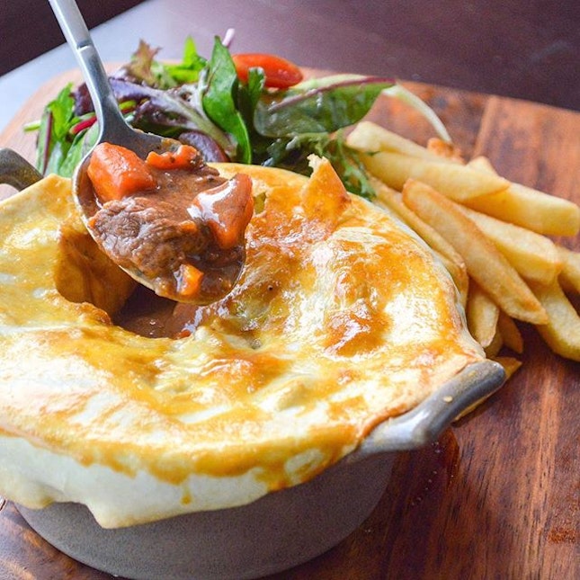 Get cosy with this Beef and Ale Pie ($19) in the sudden downpour.