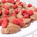 Platter of #Lindt Dark Chocolate Mousse topped with Raspberries.