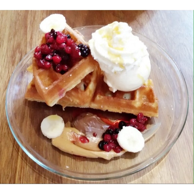 Waffle With Vanilla Ice Cream, Berries Compote, Peanut Butter And Chocolate Sauce