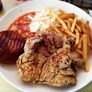 Chicken cutlet with deep fried bread, fries, coleslaw and baked beans for lunch today