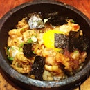"Butariki Ishinabe" - sizzling stone pot Japanese rice with pan fried and barbecued pork, seaweed and egg.