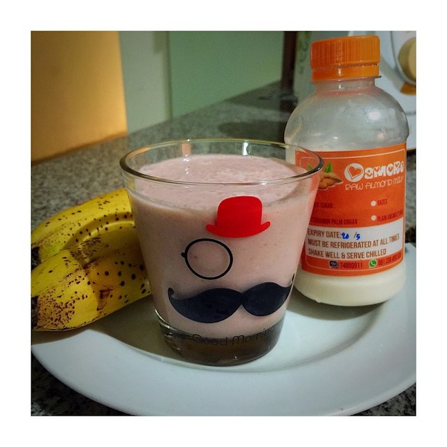 Breakfast smoothie made with #almondmilk ripen #banana #🍌 fresh #strawberries #🍓 and half cucumber.