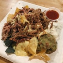 Hearty Nachos With Generous Toppings ($14)