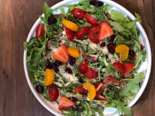 Arugula & parmesan balsamico salad with cherry tomatoes, oranges and pomegranate