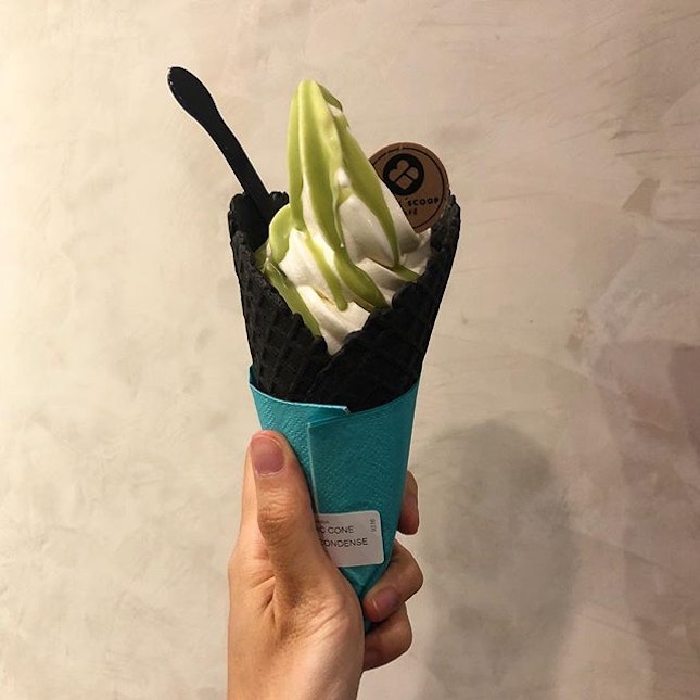 [White Rabbit Ice cream on charcoal cone]

Had initially ordered the white rabbit ice cream because I had seen a post of it on instagram with the ice cream being sculpted with bunny ears and with the candy wrapping around the cone instead of the blue napkin given here.