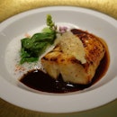 Caramelized black cod with bok choy and a Malabar black pepper sauce at Singapore's Joel Robuchon Restaurant
.