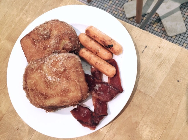 French toast with bacon and sausages ($16++)