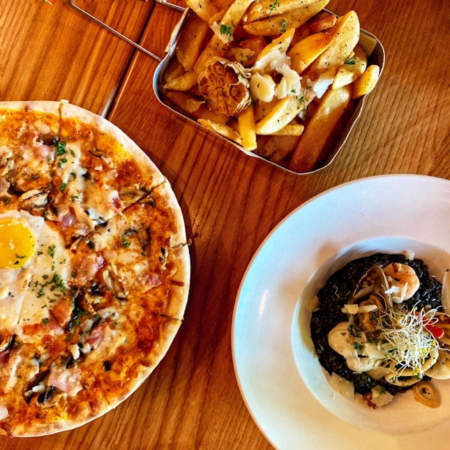 “The Morning After” Pizza ($25) // Garlic Truffle Fries ($17) // Seafood Squid Ink Risotto ($28)