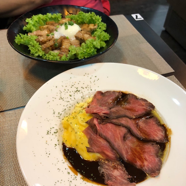 Omurice With Roast Beef ($19), Pork Belly Don ($21)