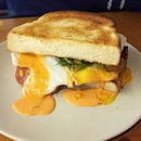 Egg Slut Hangover Sandwich (NT125) - A thick slice of bread sandwiching an pan fried egg, luncheon meat and their house made spicy thousand island sauce.