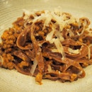 Homemade cocoa fettuccine with duck ragout Padua style