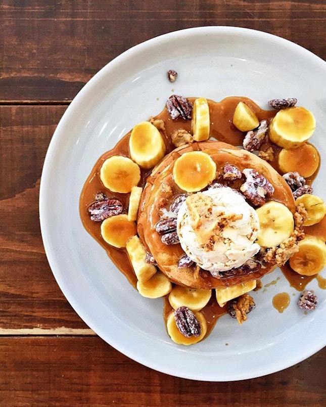 Sticky Date Pancake // A fluffy triple stack drenched in salted caramel sauce, served with fresh bananas, cookie dough and candied pecan nuts, topped with a scoop of salted caramel ice cream.