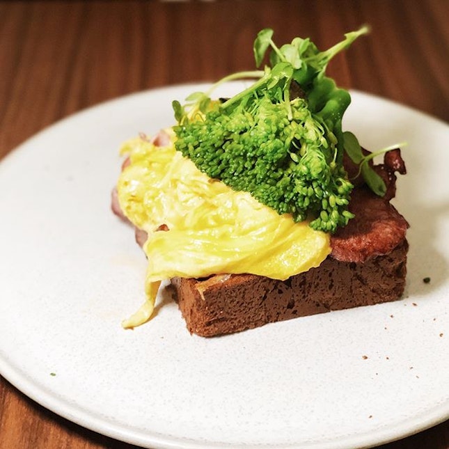 Truffle Benedict - brioche toast, scrambled eggs (special request), gammon ham, thick cut bacon, baby spinach, broccolini, shaved truffle and a truffle hollandaise.