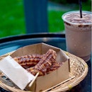 6 piece original churros topped with choco drizzle + drinks [$9.50] with an addition $1 top up to a bananutella milkshake.
