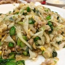 Fried keoy teow with kai lan, and its white in colour.