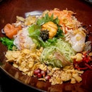 Richness Yusheng with Hokkaido Scallop, Salmon and Condiments drizzled with Pomegranate dressing