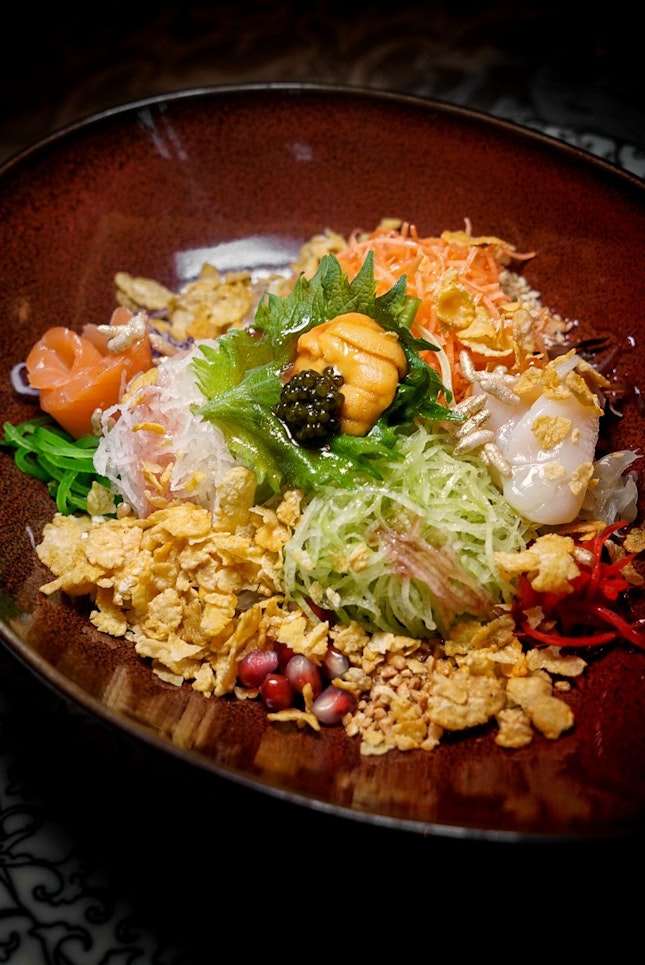Richness Yusheng with Hokkaido Scallop, Salmon and Condiments drizzled with Pomegranate dressing