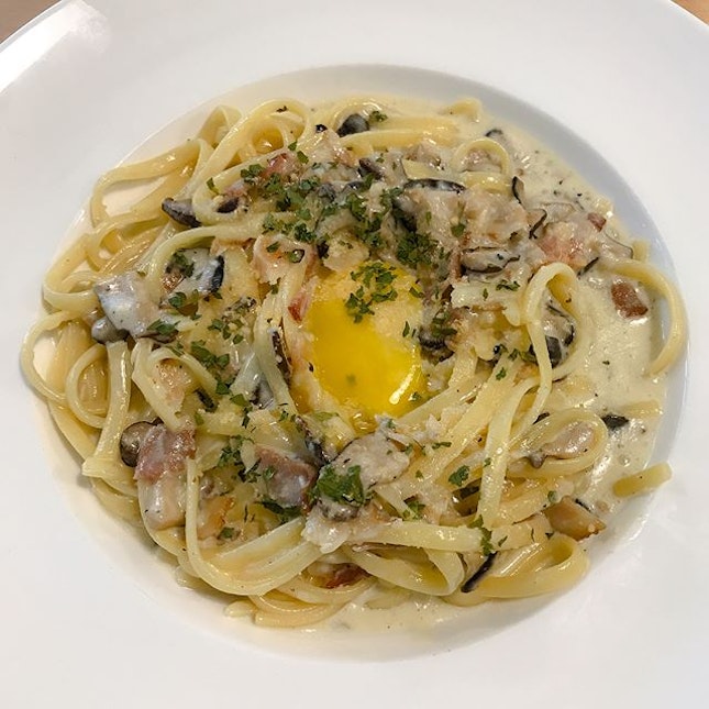 Carbonara [$16+] Linguine in a creamy carbonara sauce served with bacon, mushrooms and topped with a raw yolk.
