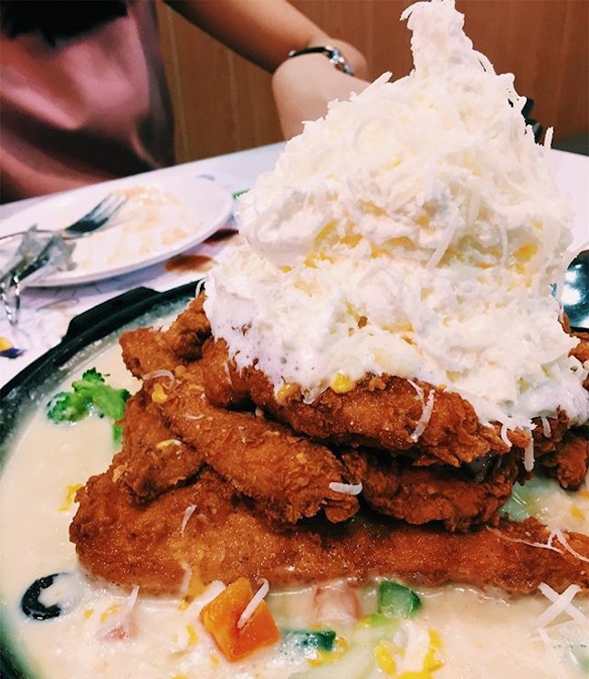 Crispy af Korean fried chicken topped with whipped potato and cream.