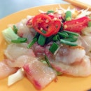 Super generous serving of raw fish topped with ginger, red chili, spring onions, fried shallots and lettuce!