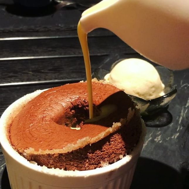 Dark Chocolate Soufflé ($18.50) | Coated with a rum of sugar, the soft and fluffy soufflé paired well with the vanilla ice cream.