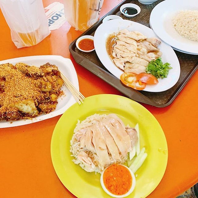 Comparing chicken rice at Maxwell food centre.