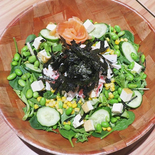 Tokyo Miso Sesame Salad - edamame, tofu, cucumber, corn, crab sticks and roasted seaweed with a salmon rose.