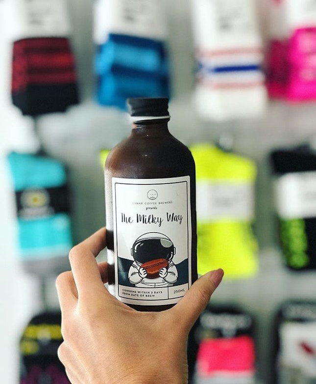 My Milky Way (White Cold Brew) ($7) from @lunarcoffeebrewers against the colorful wall of socks 🚴🏻‍♀️🧦 at @velovelosingapore Nice cold brew...