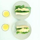 Saturday breakfast: Egg mayonnaise filled baguettes with orange juice.