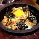 Sizzling stone pot rice with pork.