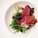 Course 1: Prosciutto salad, mixed berries, tomatoes, olives