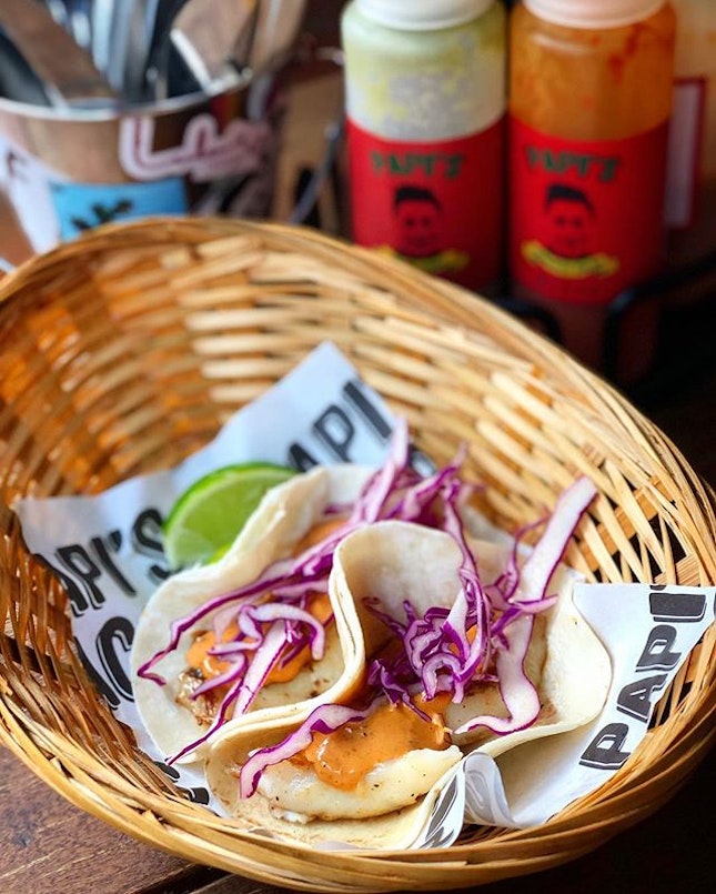Tacos de pescado ($13 for 2)  Grilled white dory, fresh cabbage, and smoked chipotle aioli on a flour tortilla.