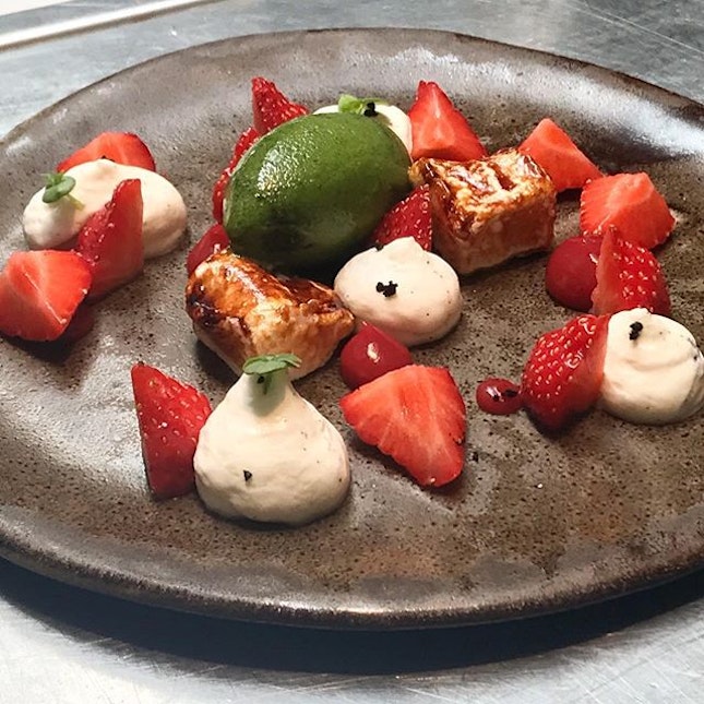 Strawberries with basil sorbet, black olive and vanilla chantilly cream.