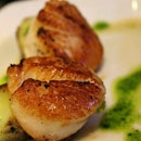 Grilled scallops with garlic and chive sauce.