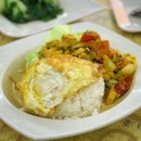 Curried pork belly rice with egg white so crispy and egg yolk so runny.