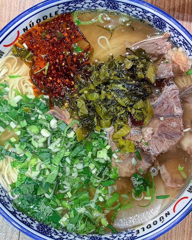 Currently obsessed: this bowl of hand-made noodle soup with braised beef, pickled mustard and that chilli.