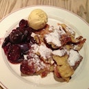 Emperor's pancake „Kaiserschmarrn" fresh from oven with plum compote